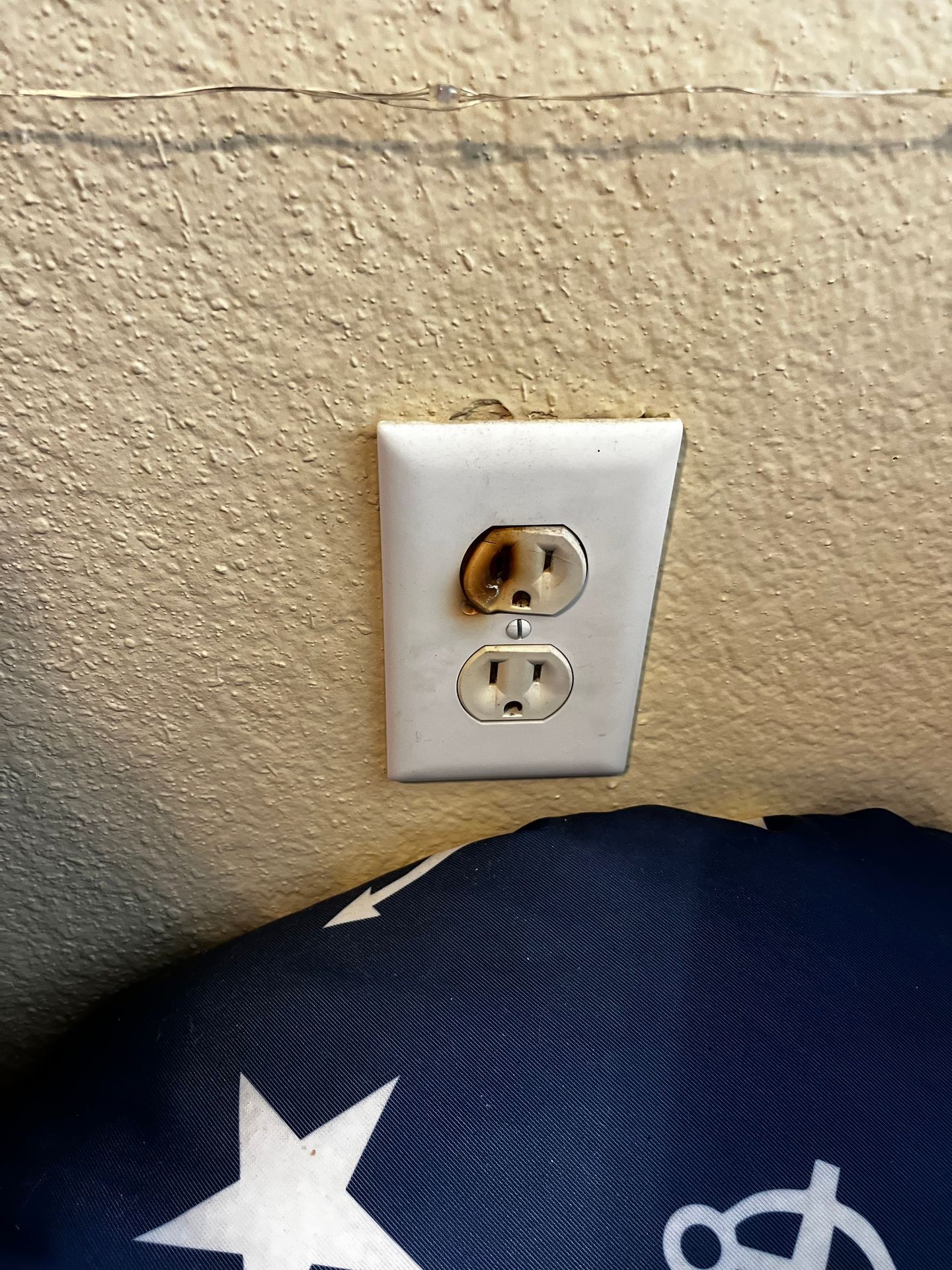 Burned outlet; fire hazard; outlet not working; new outlet replacement; electrical; power plug; electrician